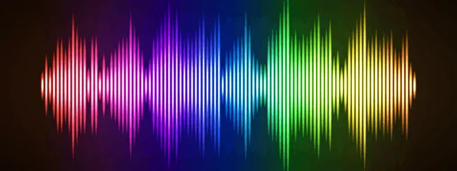 Vibrant rainbow-colored sound wave visualization on a dark background, representing music, audio, or digital sound concepts s