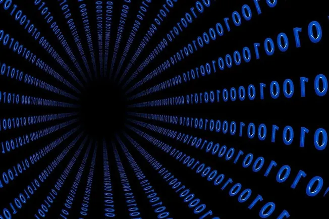 Binary code tunnel representing digital music and online entertainment trends.