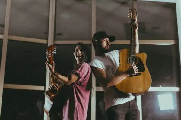 Guitarists performing together in a studio, showcasing musical creativity and collaboration for music promotion and artist de