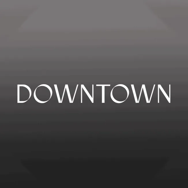 Downtown cityscape in black and white with modern architectural buildings and vibrant nightlife atmosphere.