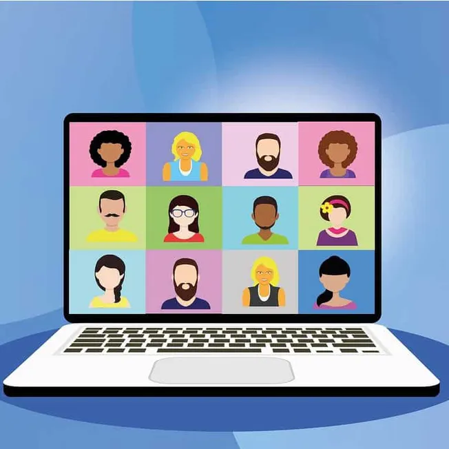 Diverse group of people participating in a virtual video conference on a laptop screen, representing online collaboration, re