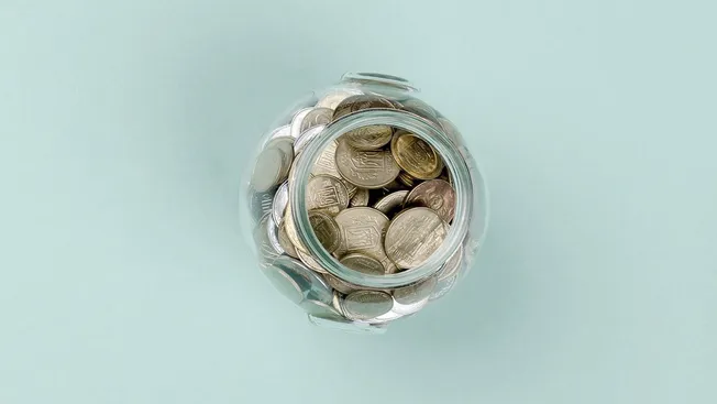 Jar filled with coins on pastel background, saving, financial growth, money management, investmentfinance, business, cryptocu