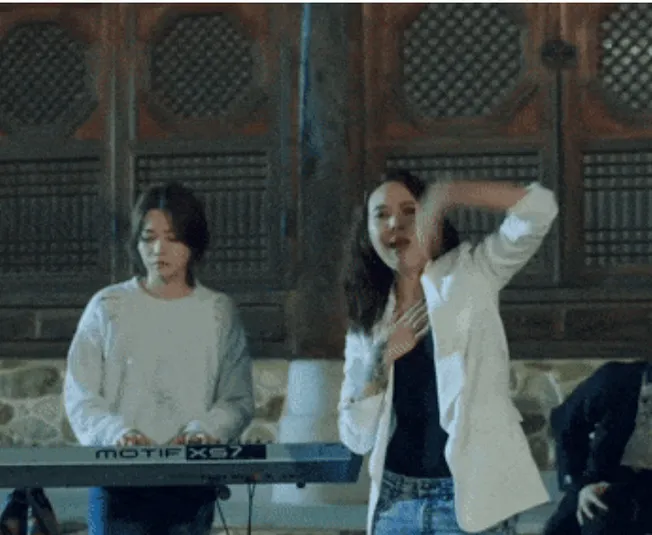 Keyboard player performing at Hypebot music event, lively concert scene, artist engaging crowd, live music performance, indus