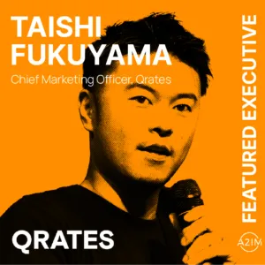 Young Asian man speaking at a conference, discussing marketing strategies, with bold orange background, featured as Taishi Fu