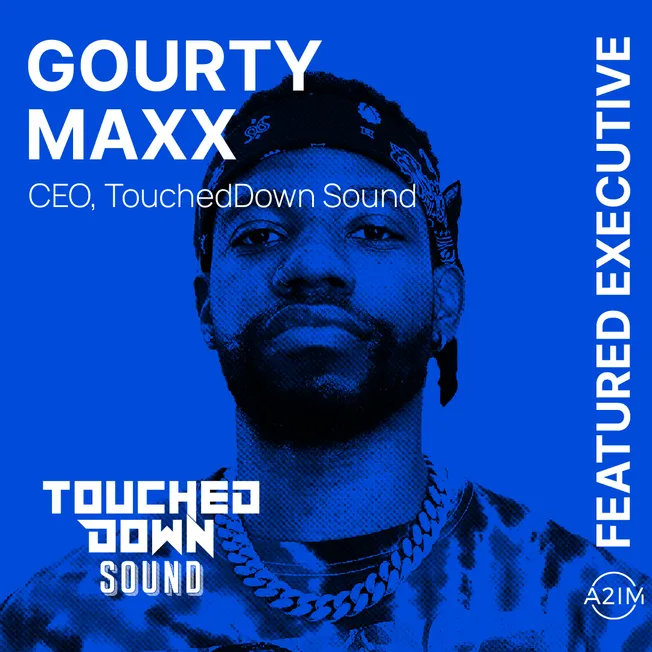 Gourty Maxx CEO of TouchedDown Sound, featuring in Hypebot's featured executives series, wearing a black bandana and chunky g