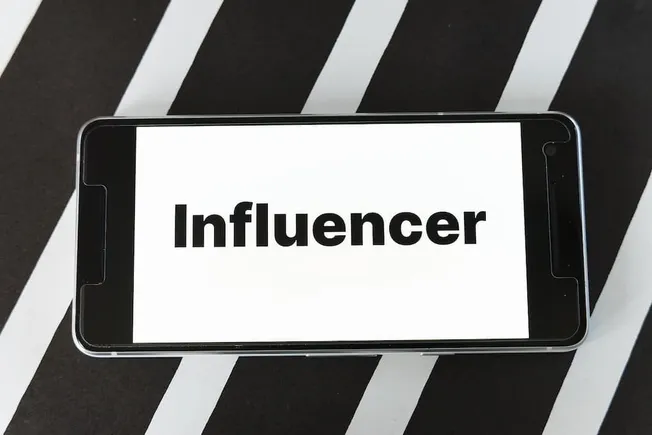 Influencer marketing on mobile device, social media influencer concept, digital branding, online influencer, social media str