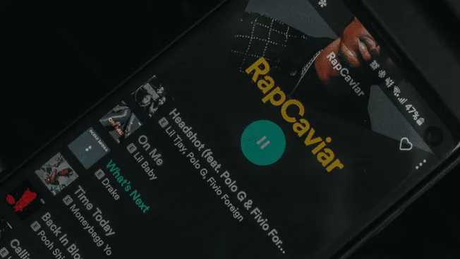 RapCaviar playlist featuring top hip-hop tracks on Spotify, illustrating popular music curation and playlist promotion.