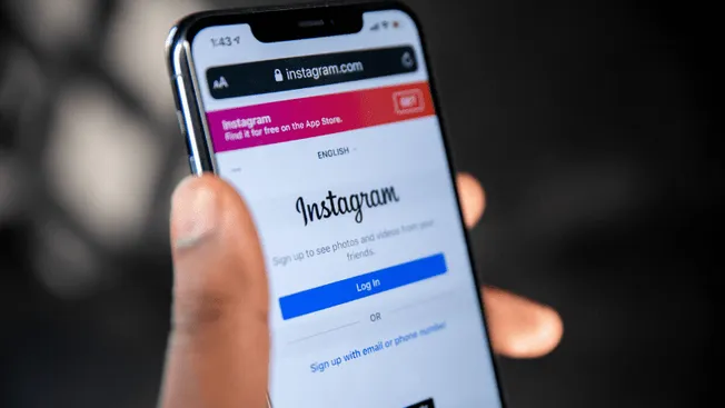 Instagram login screen on smartphone, social media app interface, mobile device capturing Instagram homepage, digital marketi
