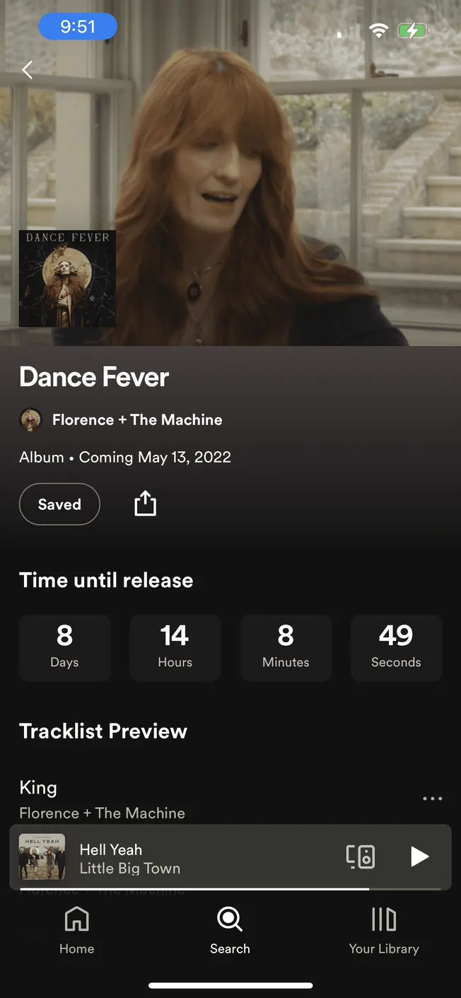 Dance Fever album cover featuring Florence + The Machine with a woman singing in a cozy indoor setting.