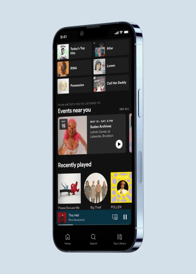 Music streaming app interface on smartphone with top hits, events, and recently played features, highlighting music discovery