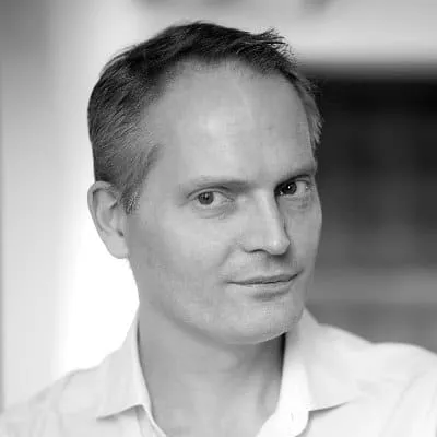 Professional male portrait, black and white image, demonstrating confidence, modern style, high-resolution, suitable for musi