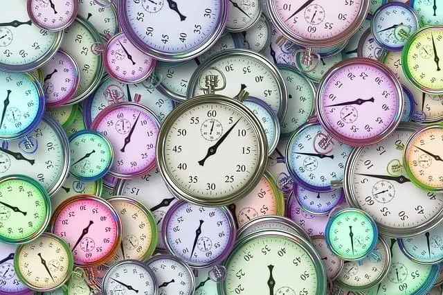 Collected colorful analog stopwatch clocks representing time management and precision. Ideal for articles on time tracking, s