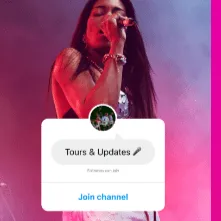 Touring musician performing on stage with vibrant lighting and energetic crowd, music industry, live performance, artist enga