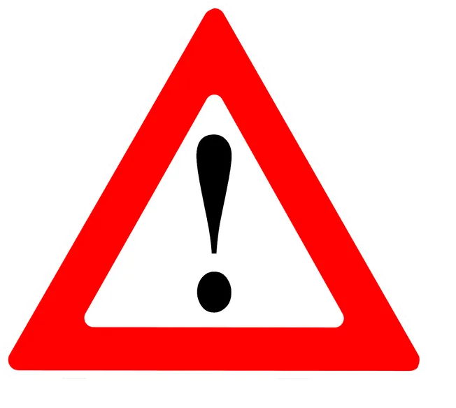Warning sign with red triangle and black exclamation mark for safety alert.