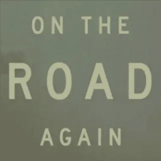 Road sign with "On The Road Again" message, symbolizing travel and music journeys, on a muted green background.