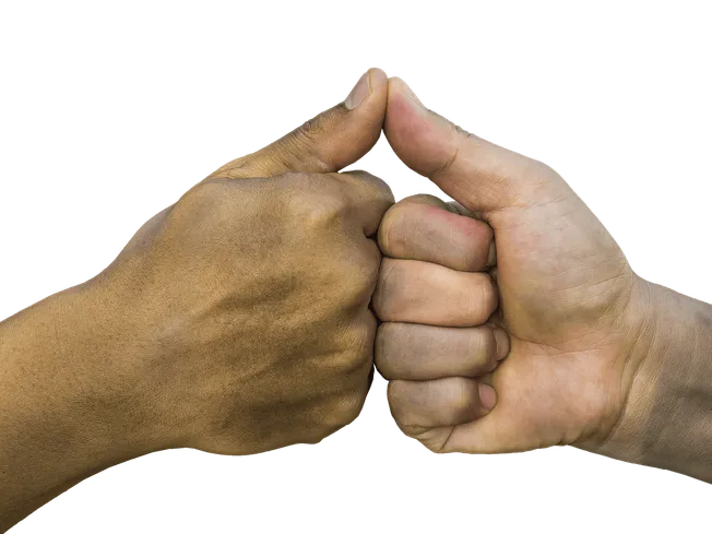 Two hands giving a fist bump, symbolizing unity and collaboration.