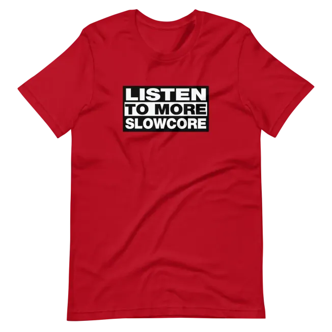 "Red T-shirt with bold white and black text reading 'Listen to More Slowcore', highlighting music genre awareness and casual