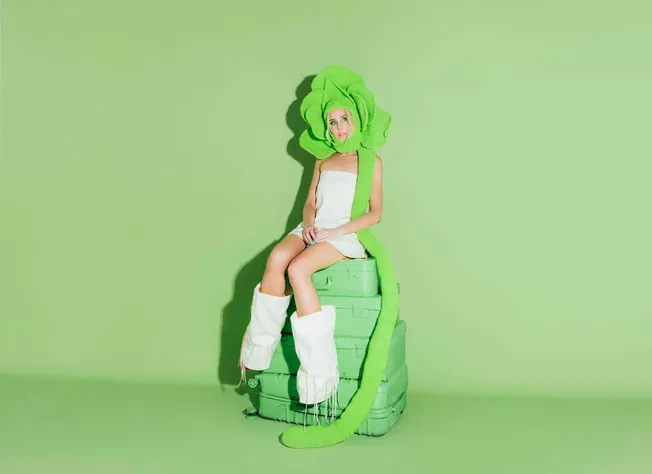 Bright green, whimsical headpiece and accessories for a creative music and entertainment industry aesthetic.