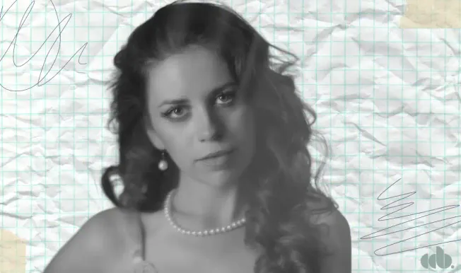 Elegant woman with wavy hair and jewelry, vintage style, crumpled notebook paper background, sophisticated, classic portrait