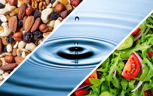 Mixed dried nuts and dried fruits, close-up on a black background, healthy snack options, natural superfoods, organic ingredi