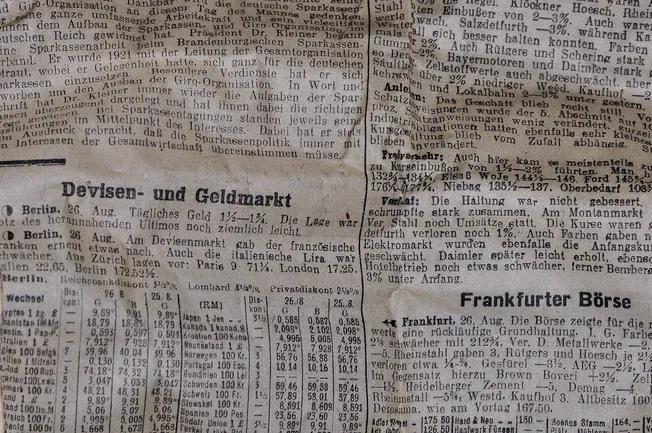 German newspaper article with stock market data and financial news, vintage newspaper style, black and white, detailed text,