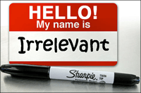 Creative name tag reading "Irrelevant" with a Sharpie marker underneath, emphasizing brand name and message.