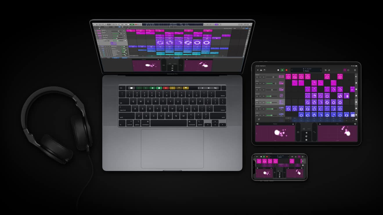Digital music production setup showing a laptop, tablet, smartphone, and headphones with music editing software, emphasizing modern music creation and audio technology.