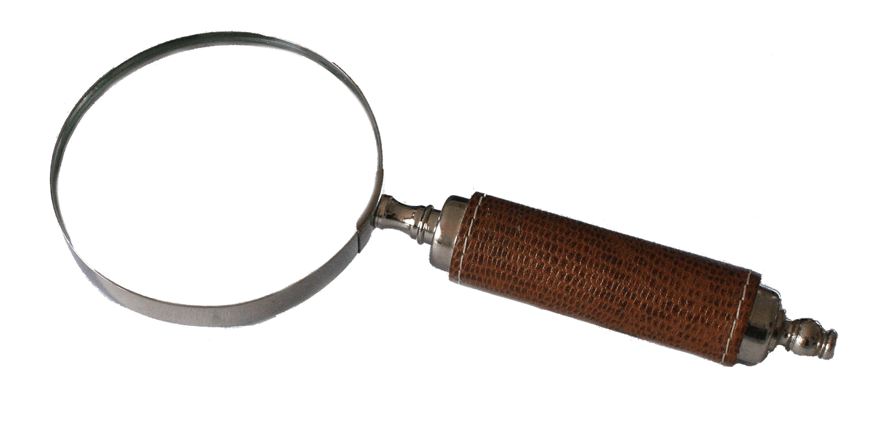Magnifying glass with wooden handle for music industry analysis and media insights.