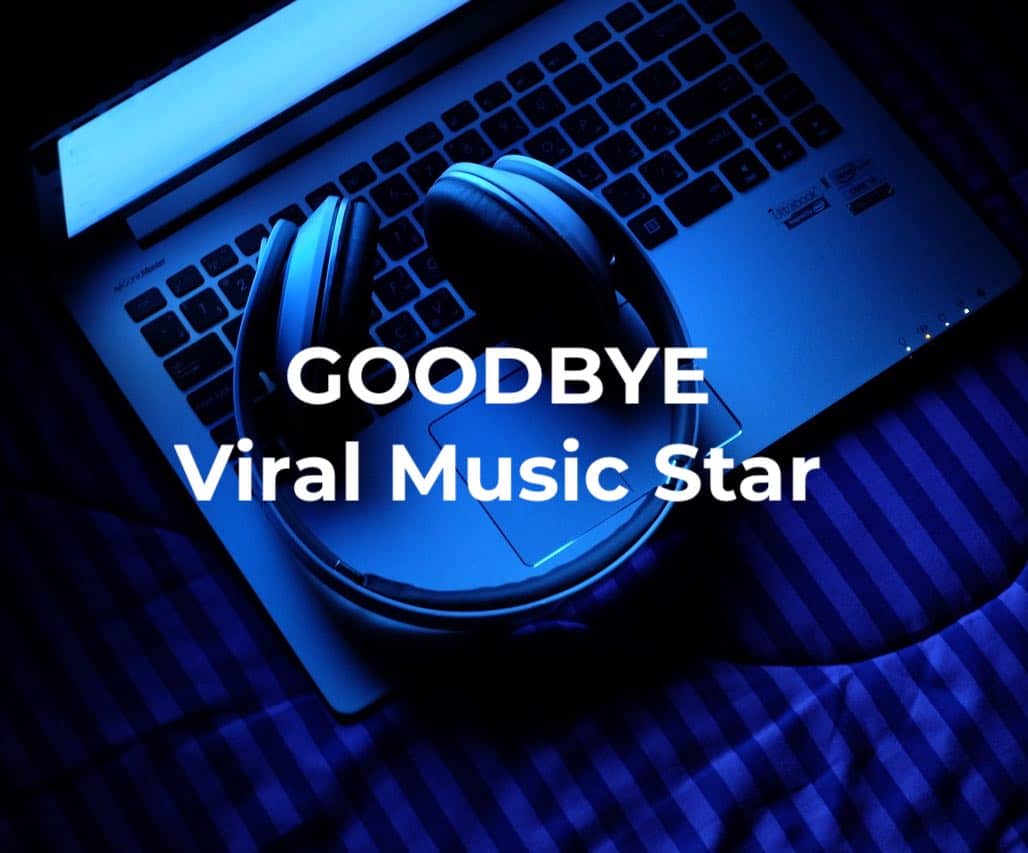 Headphones resting on a laptop keyboard with vibrant blue lighting, symbolizing the farewell to a viral music star and highlighting music industry trends and digital music technology.