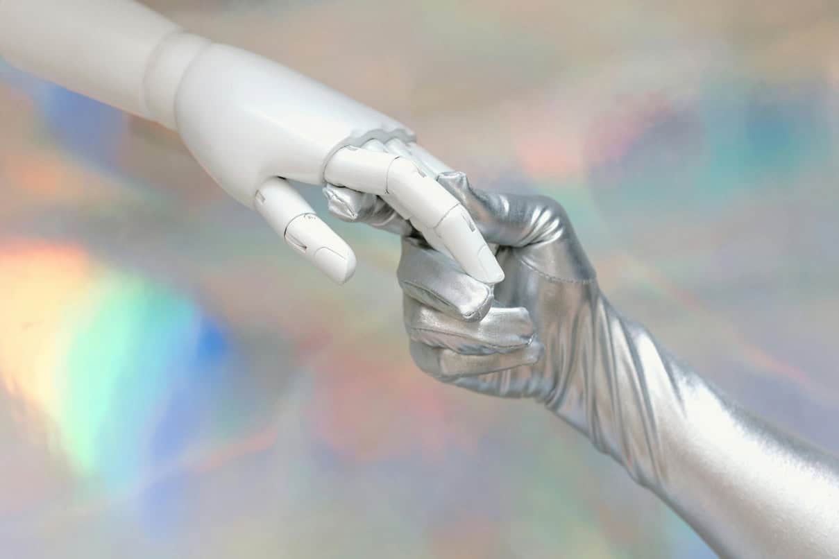 Futuristic robot hand and metallic glove reaching out, representing innovation in music technology and digital media.