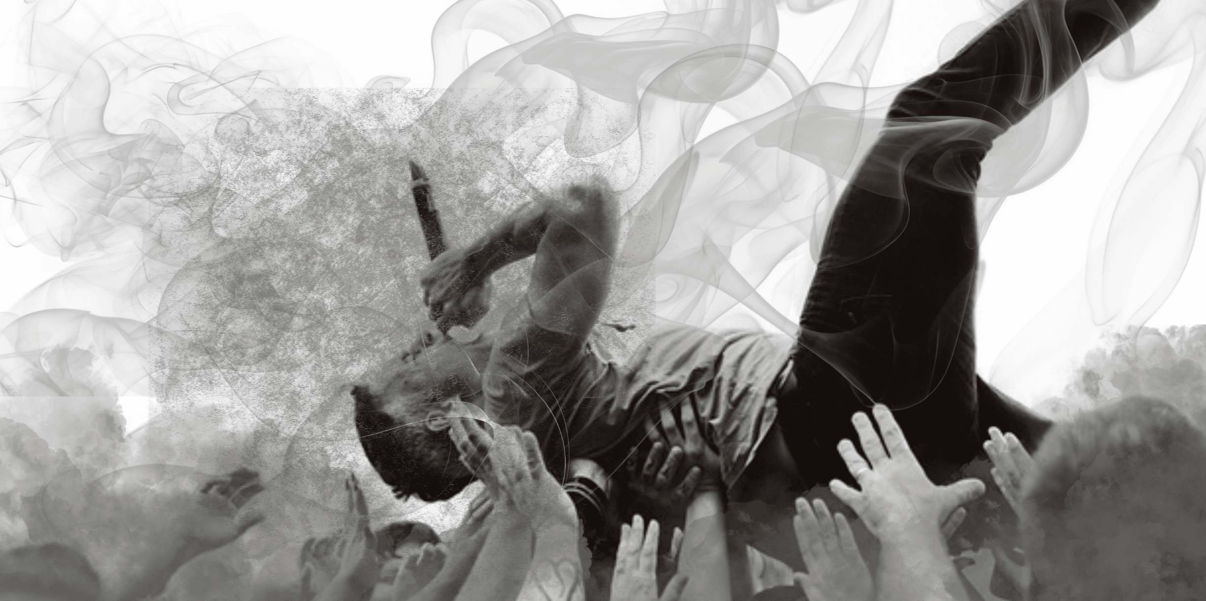 A person crowd surfing at a concert with smoke effects, symbolizing music festival culture and audience engagement; high-energy live music atmosphere.