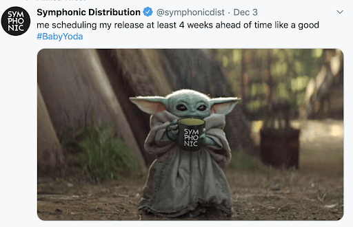 Baby Yoda holding a mug in a forest setting, promoting music release scheduling and anticipation.