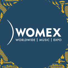 WOMEX 2023 logo showcasing world music expo, international music industry event, global artist showcase, and cultural music festival.