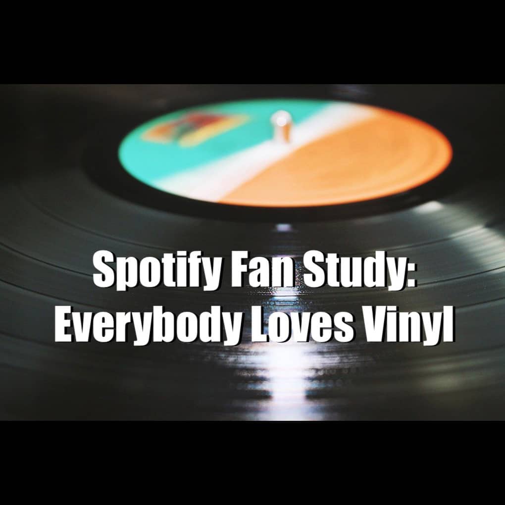 Colorful vinyl record spinning on turntable, illustrating music lovers' passion for vinyl records and the popularity of vinyl listening.