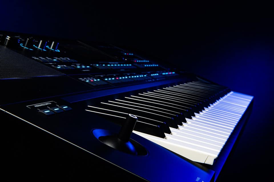 Music production keyboard with LED controls and digital interface, modern electronic music equipment for professional studio setups and music creation.