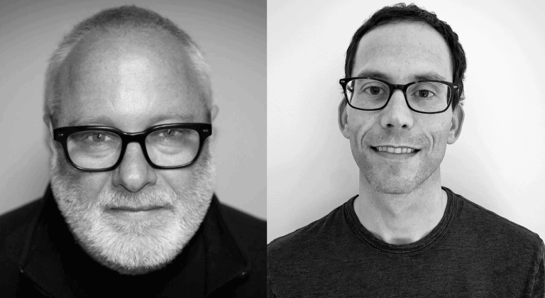Portrait of two men wearing glasses, black and white image, representing a professional or interview setting for Hypebot articles about music industry insights.