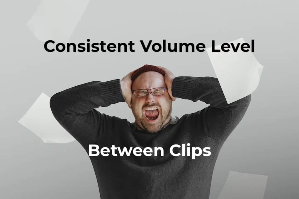 Stressed man holding head with hands and distressed expression, illustrating the importance of consistent volume level in audio editing.