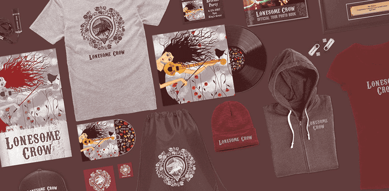 Lonesome Crow band merchandise, including T-shirts, hoodies, hats, vinyl records, and album artwork, displayed on a flat surface, representing music promotion and fan gear for alternative rock fans.