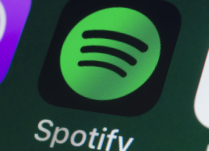 Spotify app icon on a smartphone screen, digital music, music streaming, popular music platform, entertainment technology, digital media, derived from hypebot content about music industry trends.