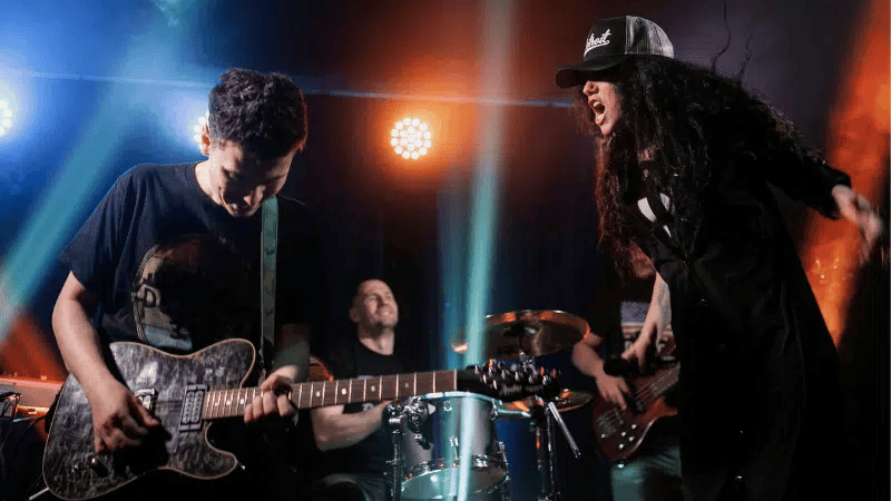 Young musicians performing live at a concert, highlighting music industry, live performance, and artist promotion on Hypebot.